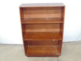 Mid century teak open bookcase with two fixed shelves, standing on a plinth base (which is separate)
