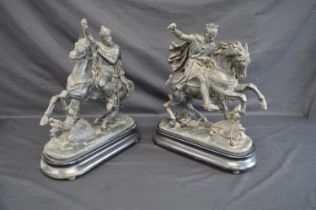 Pair of metal figures of Richard I and Edward III on horseback going into battle, standing on shaped