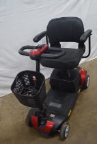 Un-named four wheel mobility scooter with charger and key (sold as seen) Please note descriptions