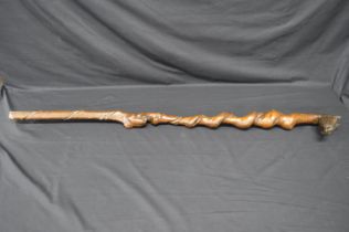Twisted shaft thumb stick having carved horse head handle with bridle, the shaft being formed of two