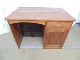 Oak single pedestal writing desk having a two plank top (warped) over a single drawer with panel