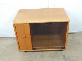 Jesper International Made In Denmark teak media cabinet the two glass doors opening to a single