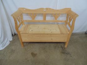 Modern pine box seated hall settle having foliate detail to the back and sides, hinged lift top seat