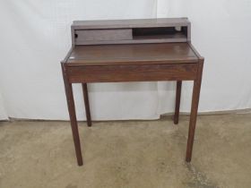 Dark oak Leonie desk having raised top section with a single sliding door over a sliding desk top