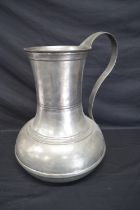 Large pewter ewer having impressed marks to base - 47.5cm tall Please note descriptions are not