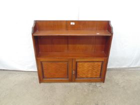 Mahogany wall cabinet having two shelves over two panelled marquetry doors enclosing a single fitted