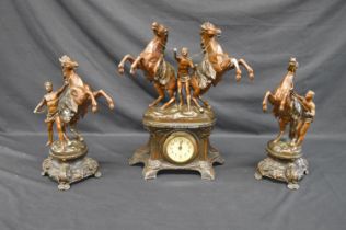 Painted spelter three piece clock garniture set having horse and handler pediments - clock 44.5cm