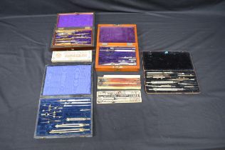 Collection of drawing implements to include: compasses and pens etc, some housed in wooden cases