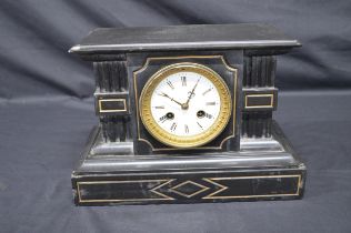 Black slate mantle clock with gilt painted highlights, white enamel dial, black Roman Numerals and