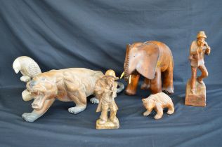 Group of six carved wooden figures to include: parrot, bear and elephant etc Please note