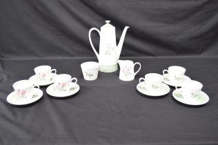 Un-named hand painted teaset having decoration of roses to comprise: teapot, milk jug, sugar bowl,