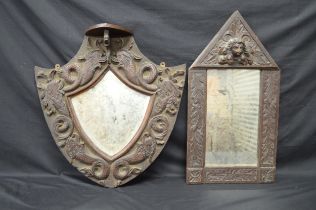 Oak shield shaped mirror, the frame carved with fish - 49.5cm x 51cm together with one other