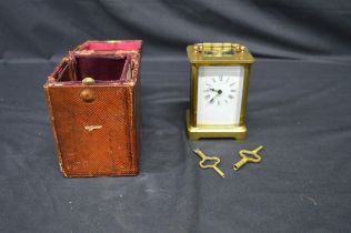 Un-named brass cased carriage clock having white enamel dial, black Roman Numerals and black