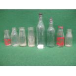 Six vintage milk bottles from different dairies together with two R Whites bottles with stoppers