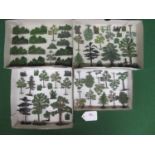 Four trays of diecast trees, shrubs, hedging and flowers from Britains etc Please note