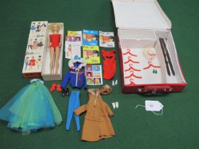 1960's Mattel Barbie fashion doll with ash blonde hair, blue side glancing eyes and wearing a red