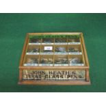 Wood and glass shop counter top display case for John Heath Pens with twelve labelled sections