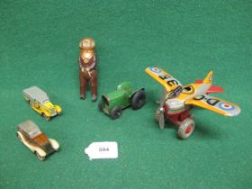 Four clockwork tinplate toys to comprise: a Made In Japan by KT fighter plane whose propeller