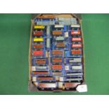 Thirty four Hornby Dublo 3 Rail tinplate wagons and Guards vans for GW, NE, LMS and BR, boxed (in