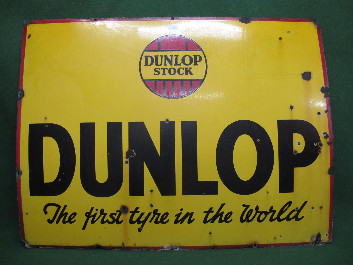 Pre-war enamel sign for Dunlop - The First Tyre In The World, black and red on a yellow ground