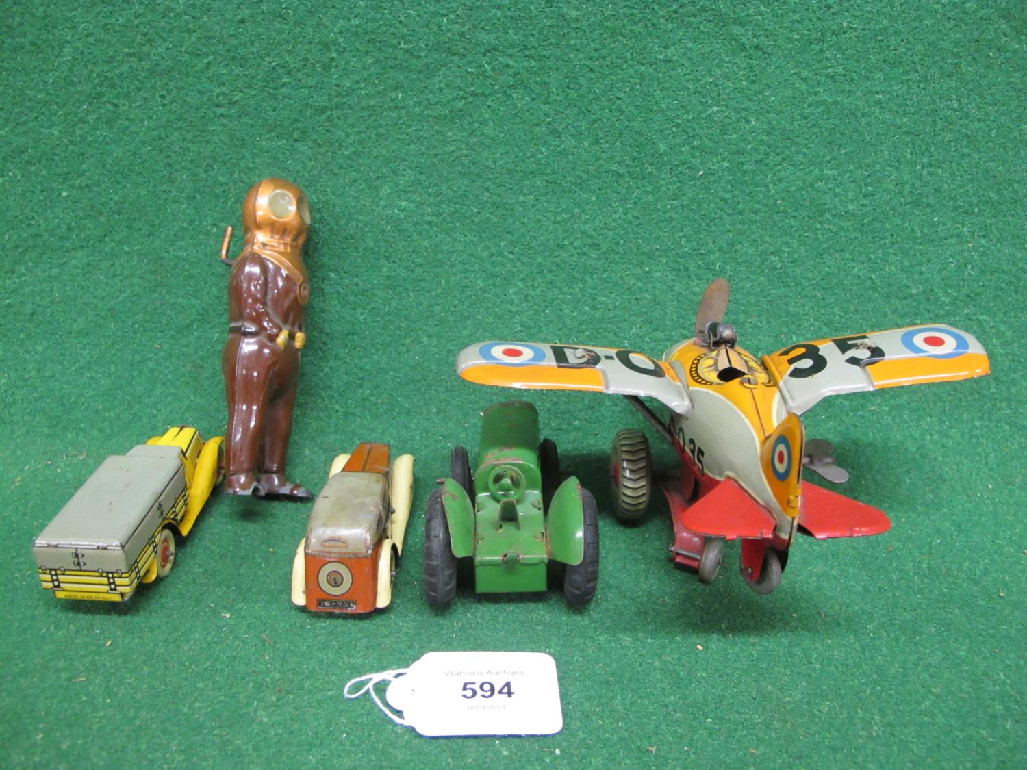 Four clockwork tinplate toys to comprise: a Made In Japan by KT fighter plane whose propeller - Image 3 of 3