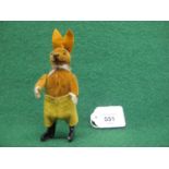 German Schuco clockwork tinplate and velvet spinning rabbit in yellow shorts (working order) - 5"