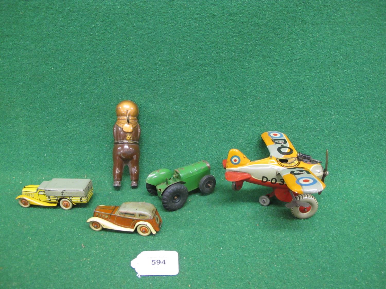 Four clockwork tinplate toys to comprise: a Made In Japan by KT fighter plane whose propeller - Image 2 of 3