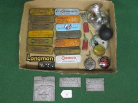 Thirteen puncture repair tins, small bulb horn etc together with three lead printing plates for