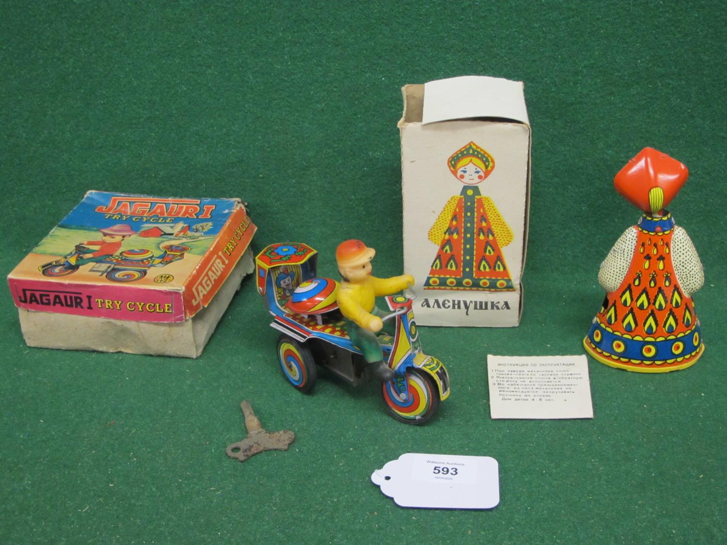 Two tinplate and plastic clockwork toys to comprise: a Jaguar I by MIG tricycle with key, rider,