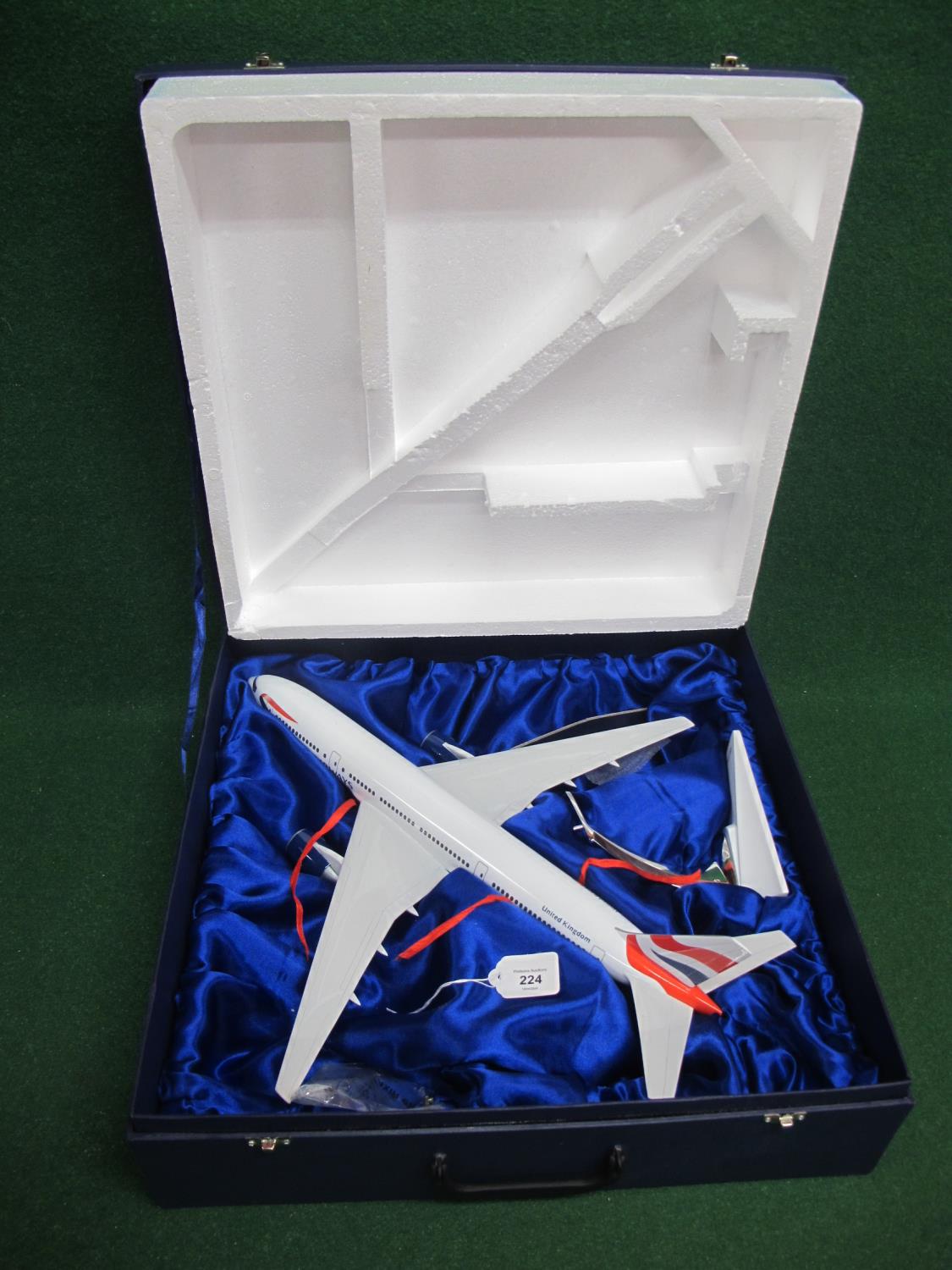 1990's large desktop model of a British Airways Boeing 777 with QC label on belly, in presentation