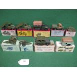 Nine boxed Britains military vehicles and guns to comprise: 1201 Royal Artillery gun, 1334 Four