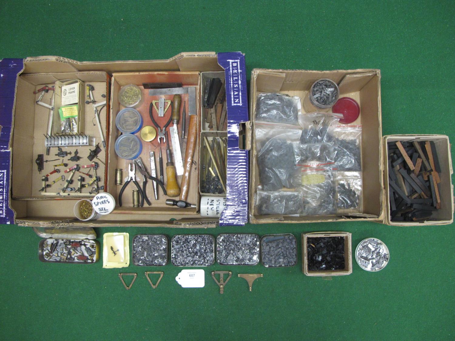 Two boxes of O gauge track laying parts and tools to include: large quantity of cast and sprung