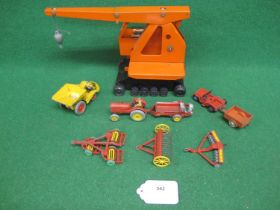 Triang tinplate working crane with driver (one track missing) together with a Dinky dumper, tractor,