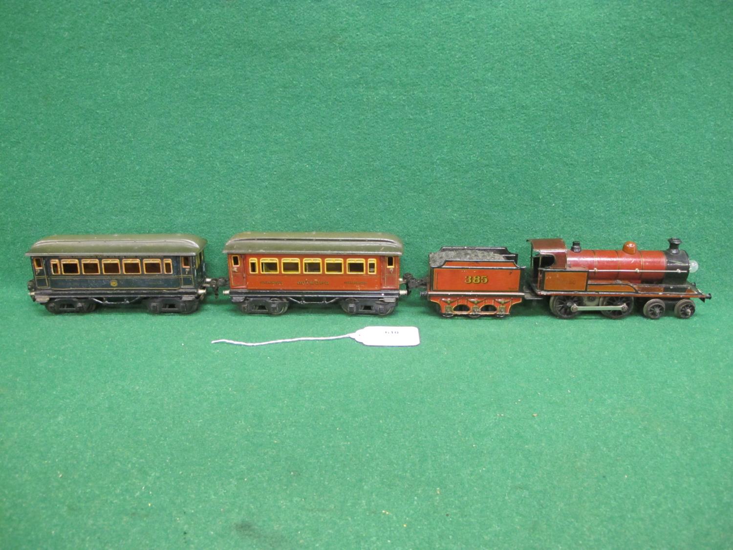 Marklin 4 volt O gauge 4-4-0 locomotive and tender No. 385 in lined red, two Bogie coaches with - Image 4 of 8