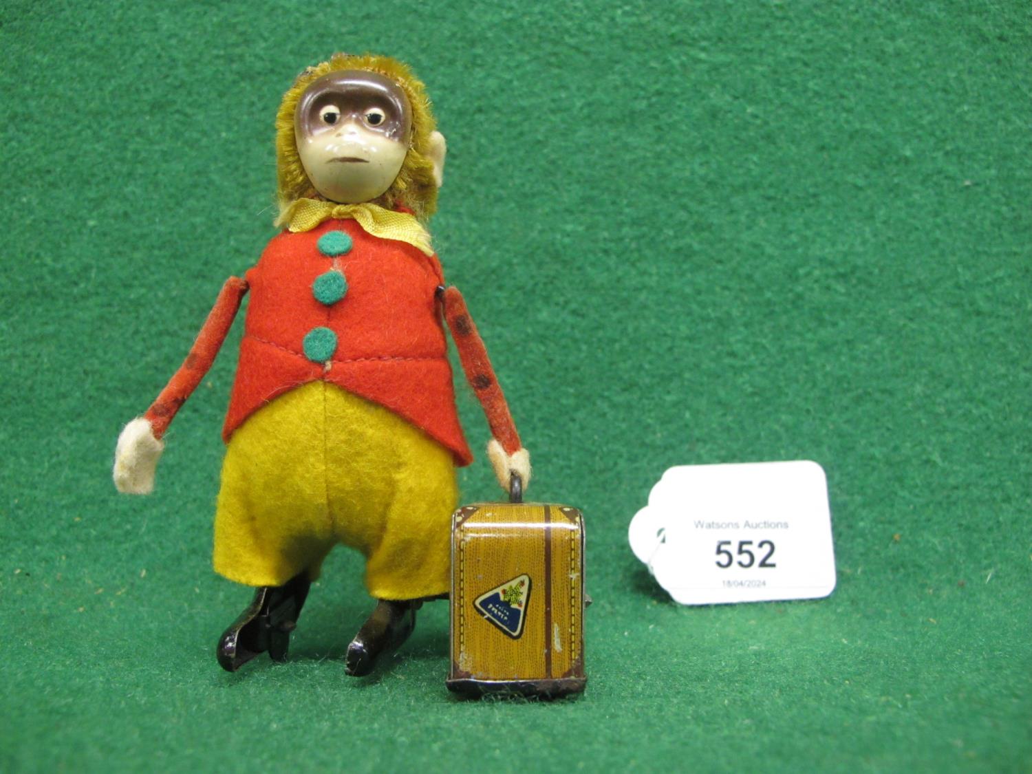 German Schuco clockwork tinplate velvet and mohair monkey with suitcase (in working order but hat