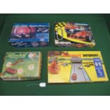 Four different slot type car sets to comprise: Matchbox Motorway No. 12 with four vehicles and