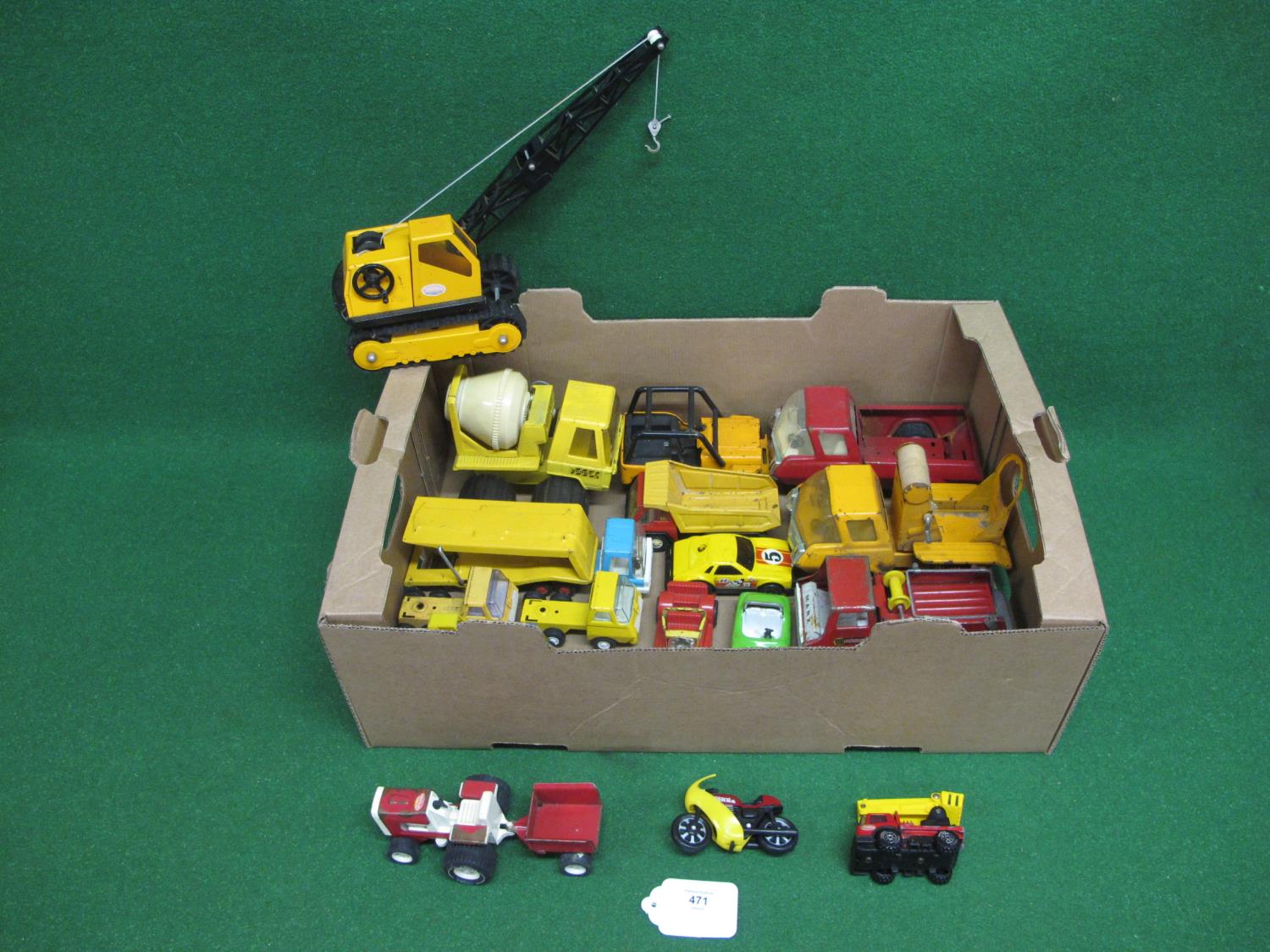 Twenty one mostly Tonka, modern tinplate and plastic vehicles from tracked crane to motorcycle