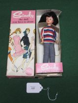 Circa 1960 brunette Pedigree Sindy wearing the Weekender outfit of striped top, jeans and white