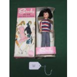 Circa 1960 brunette Pedigree Sindy wearing the Weekender outfit of striped top, jeans and white