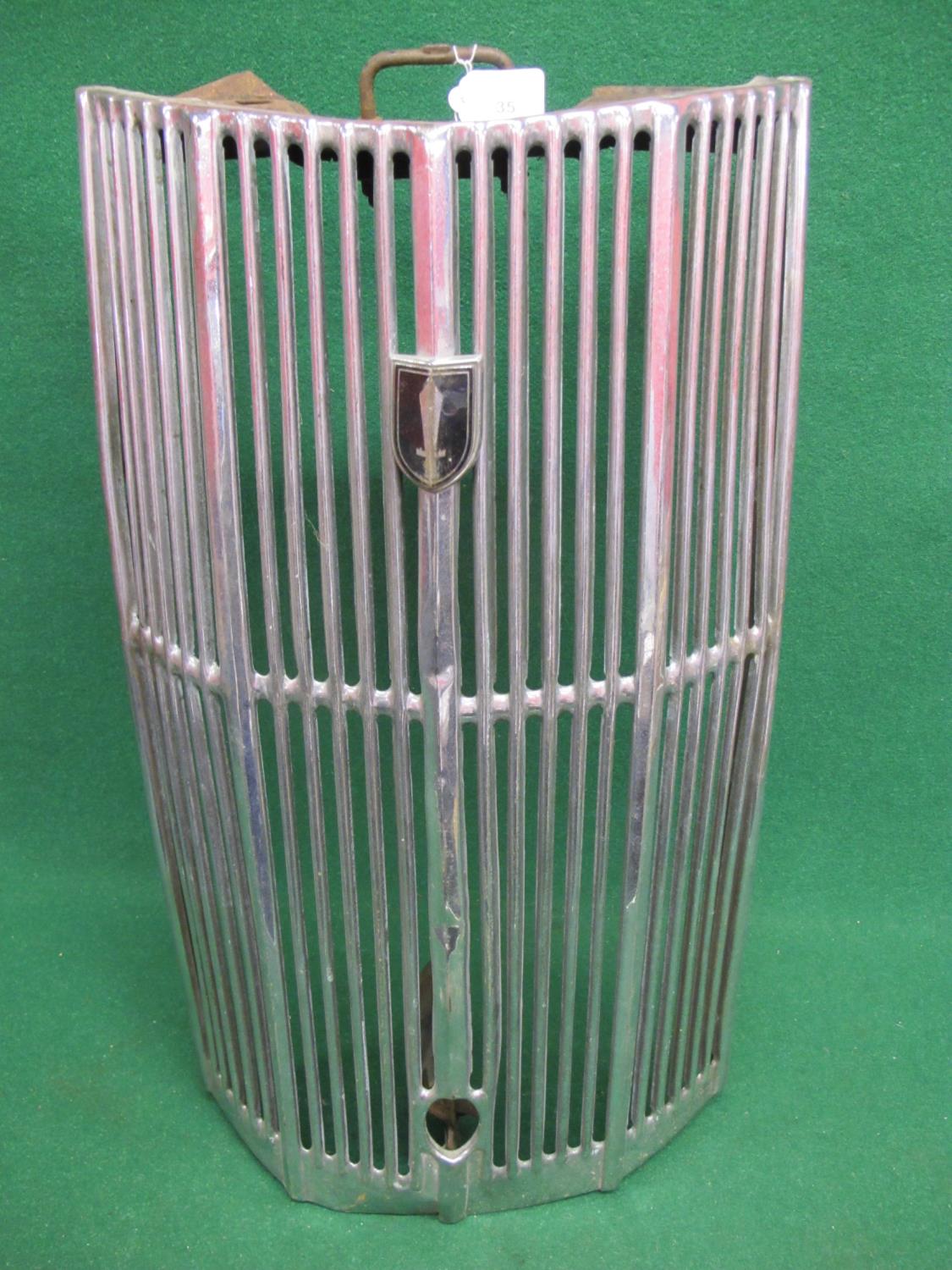 Vertical chromed radiator grill with starting handle hole and badge - 26" tall Please note