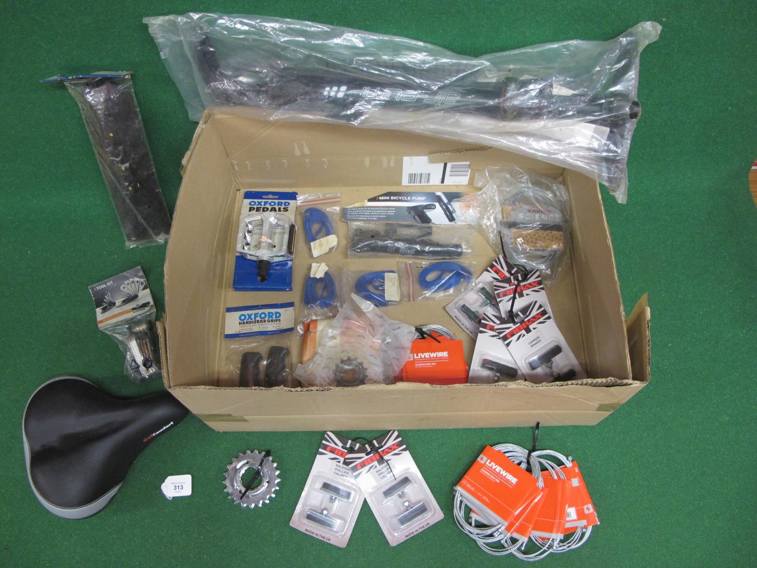 Box of new old stock bicycle items to include: rod brake blocks, cables, pumps, mud catcher, pedals,