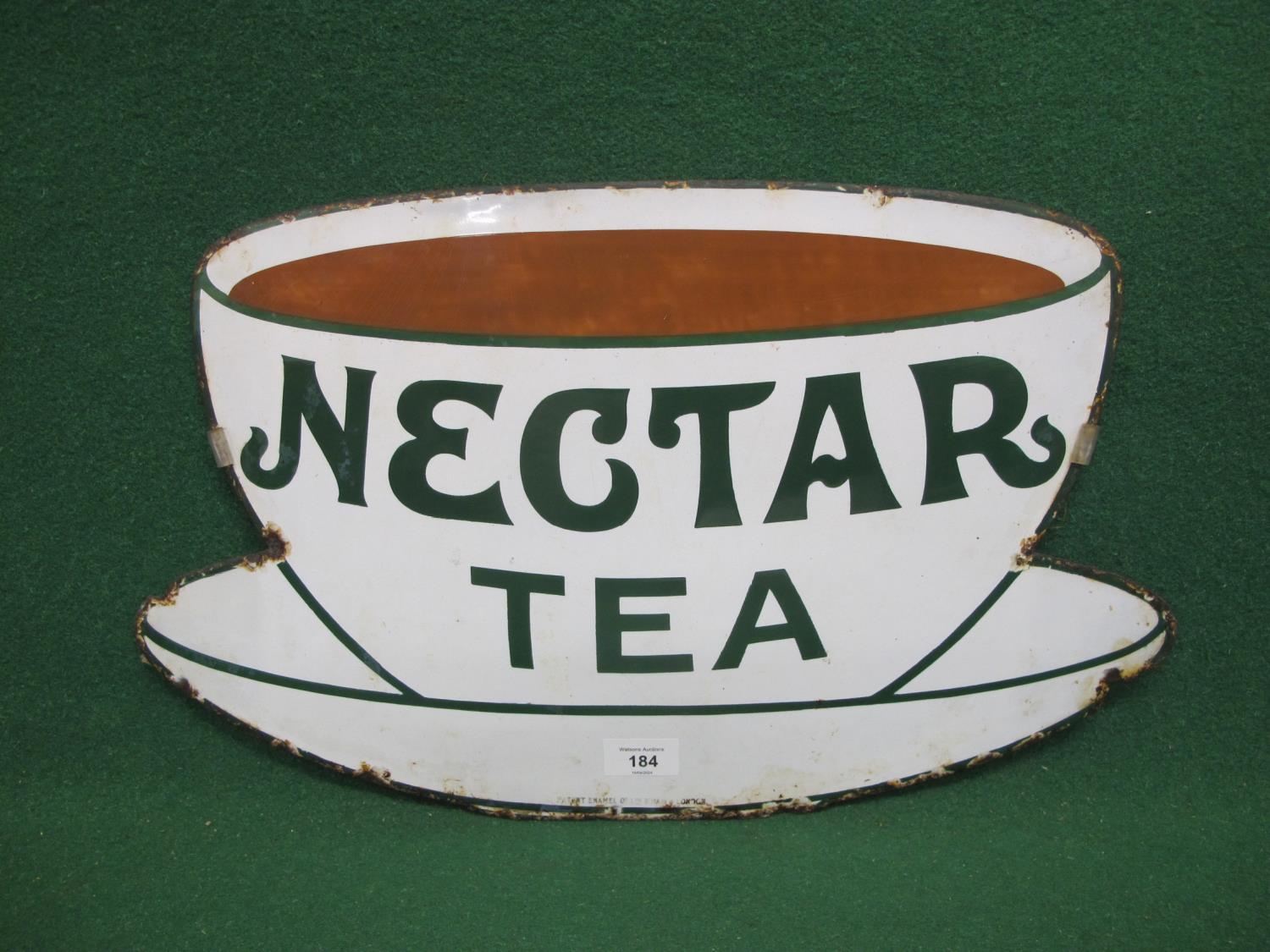 Cup and saucer shaped enamel advertising sign for Nectar Tea, green letters and brown tea on a white