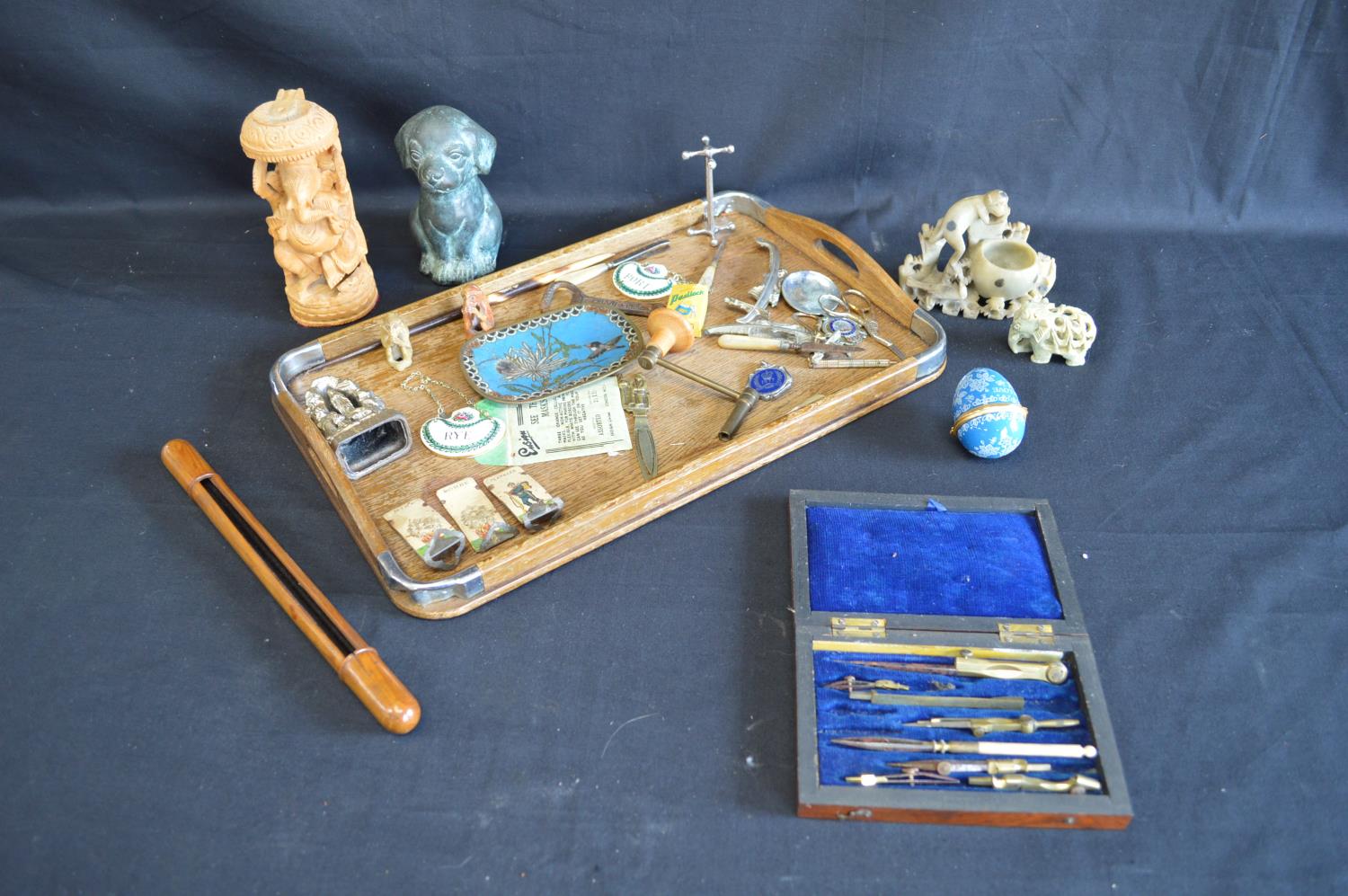 Group of sundry items to include: oak tray, bronze puppy, cloisonne dish and soap stone carvings etc