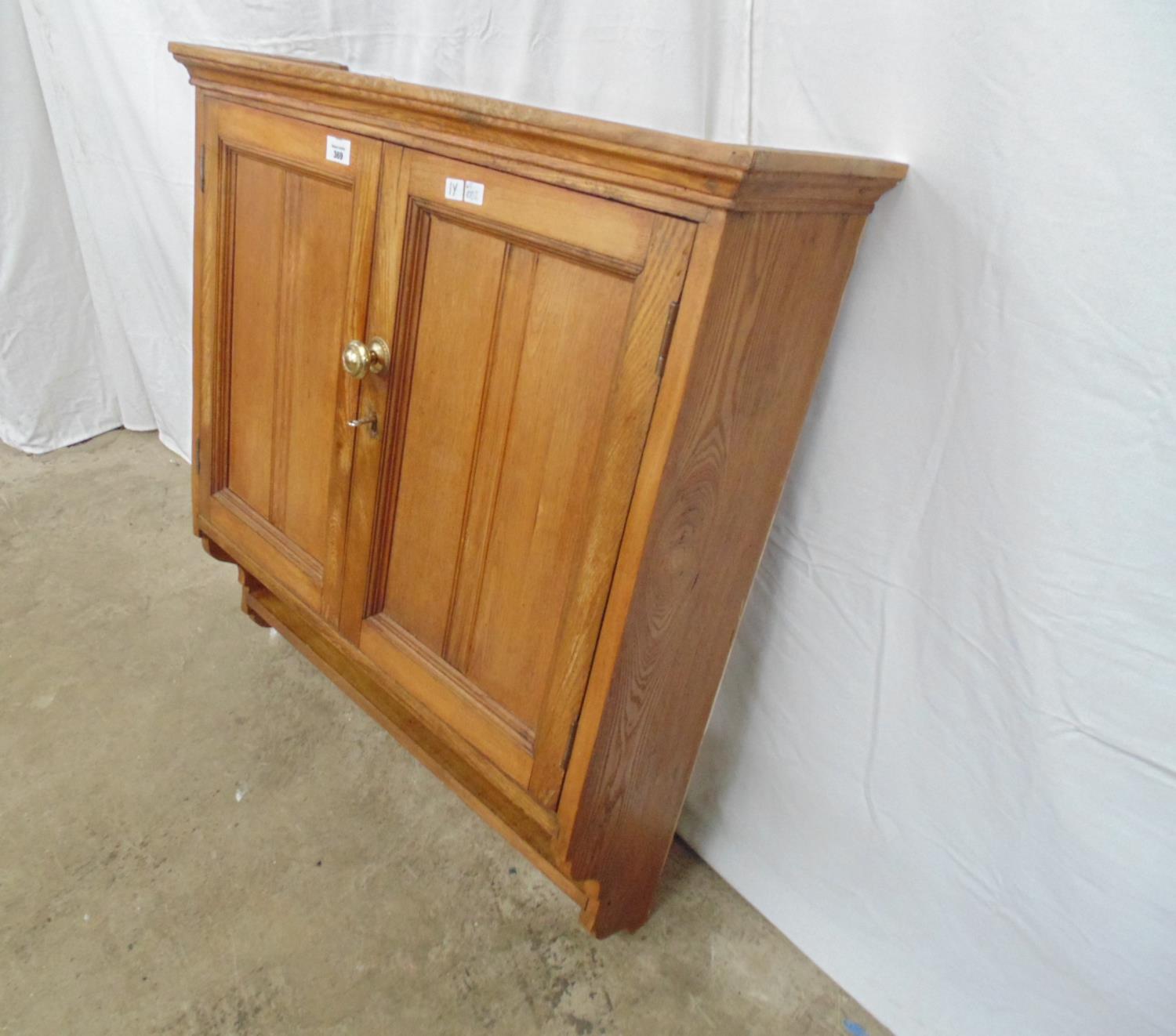 Oak wall cupboard having two moulded panelled doors opening to reveal a single fixed shelf with - Image 2 of 3