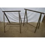 Two metal trestle stands - 70cm and 80cm wide x 77cm tall together with two small wooden saw