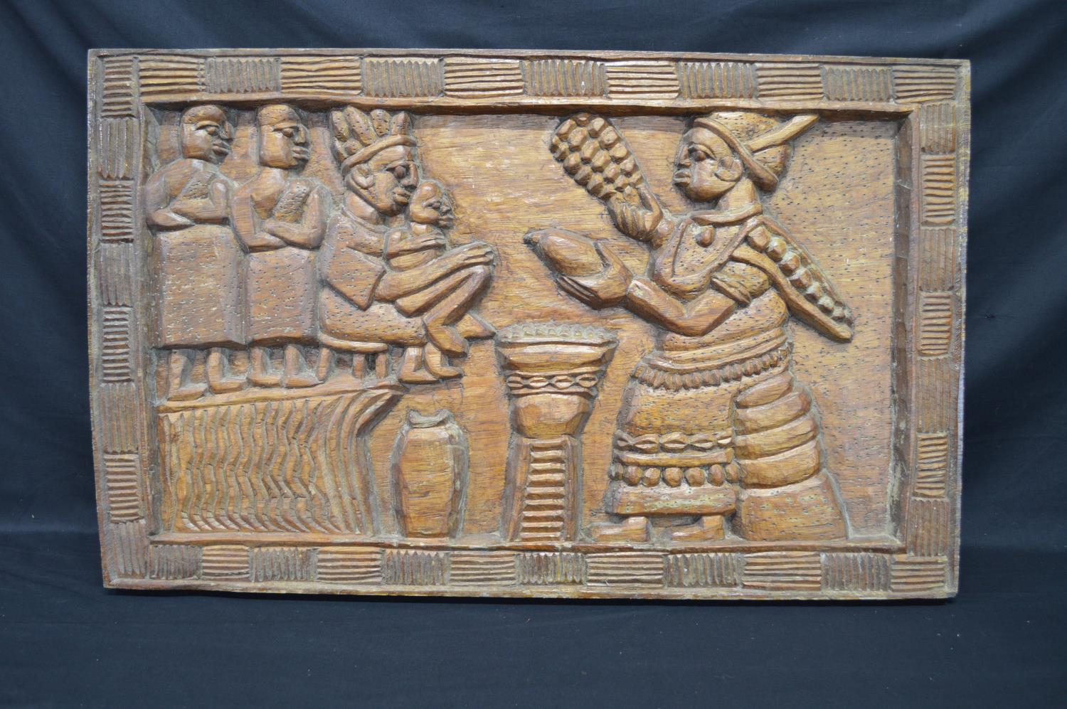 Carved hardwood possibly African panel of figures with carved border - 84cm x 52cm x 5cm Please note