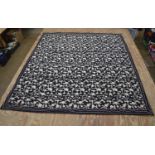 Large floral needlework on a black ground - approx 213cm x 234cm Please note descriptions are not