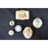 Group of five Halcyon Days enamel trinket boxes (four Winnie the Pooh and floral decorated) together