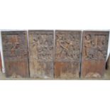 Set of four carved hardwood possibly African panels each decorated with figures and numbered in