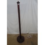 Hardwood standard lamp having carved floral decoration, standing on round base - 38cm dia x 162cm